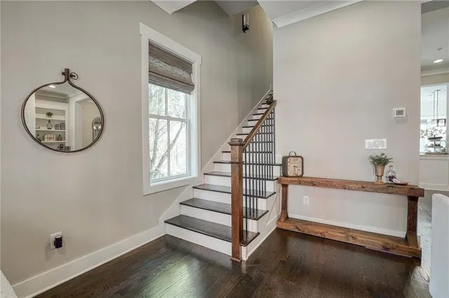 a view of entryway with wooden floor and a window