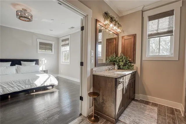 a spacious bathroom with a double vanity sink and a mirror
