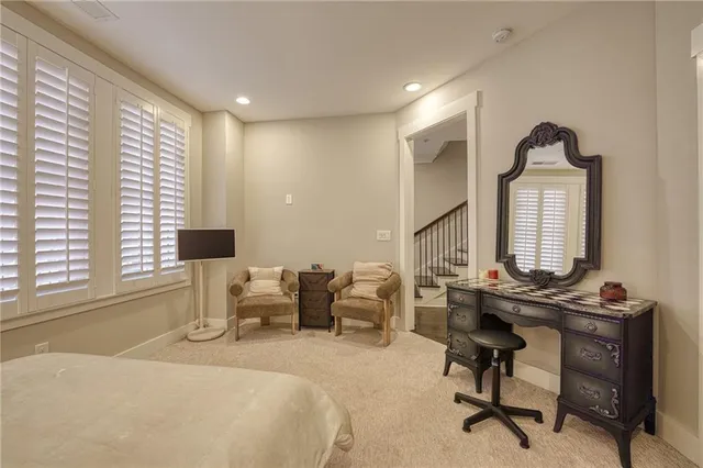 a view of a livingroom with furniture and a window