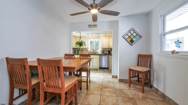 a dining room with furniture and window