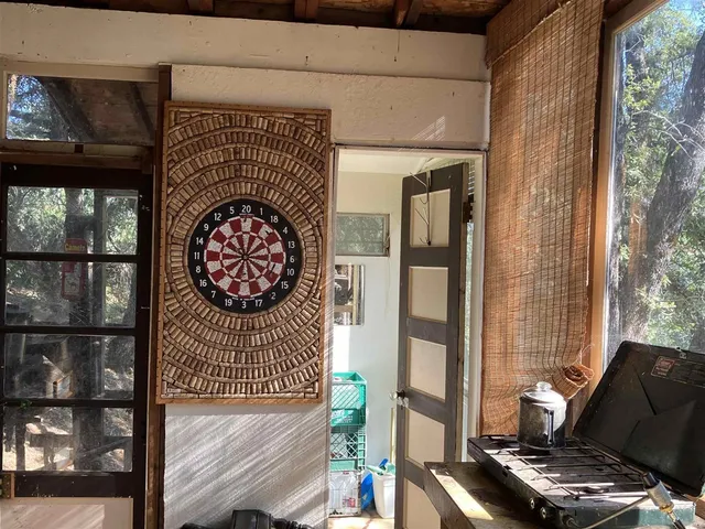 a living room with a fireplace and a flat screen tv