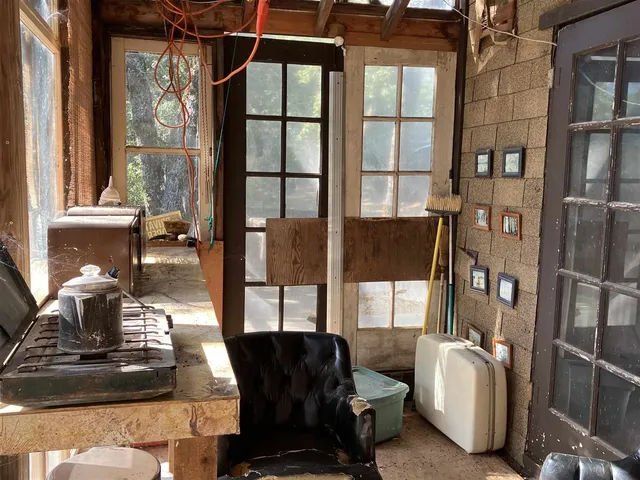 a view of a house with a tree in front