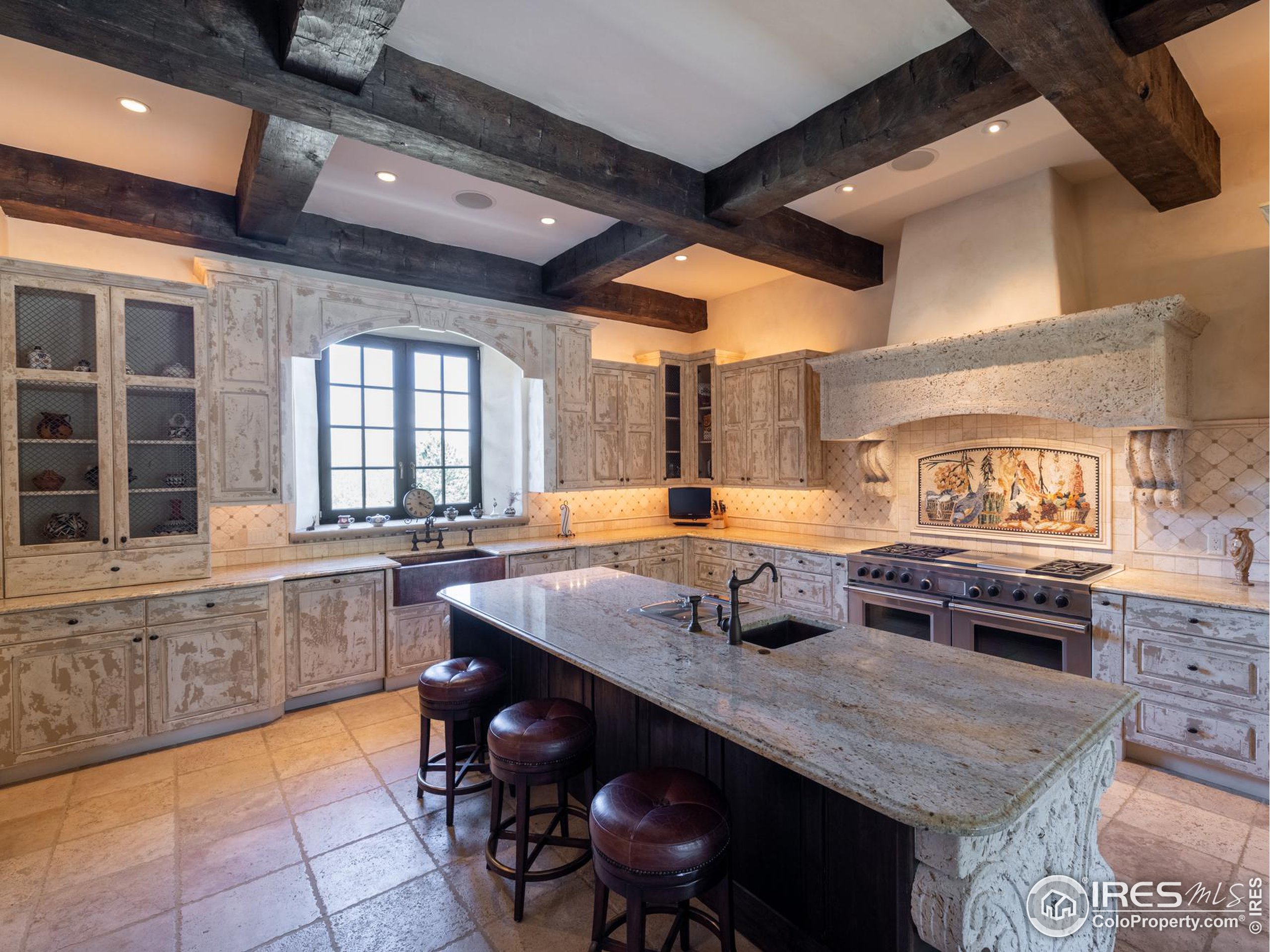 9200 Old Flowers Road Bellvue, CO 80512 - Photo 19 of 50 a kitchen with stainless steel appliances granite countertop a stove a sink and a refrigerator