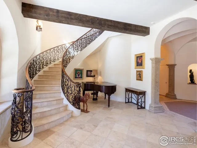 a view of a lush green hillside and a houses