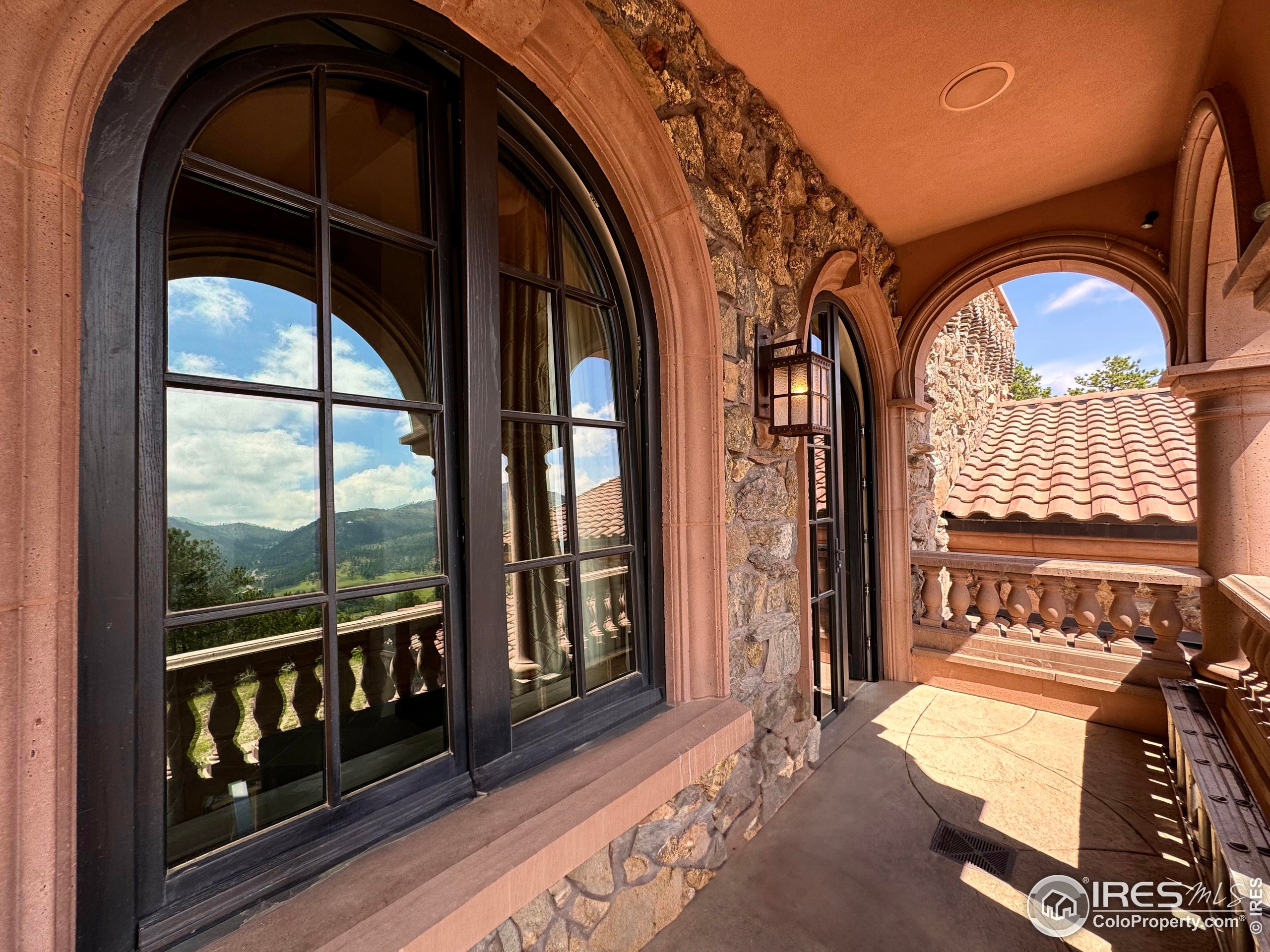 9200 Old Flowers Road Bellvue, CO 80512 - Photo 32 of 50 a view of an entryway with a floor to ceiling window and a living room