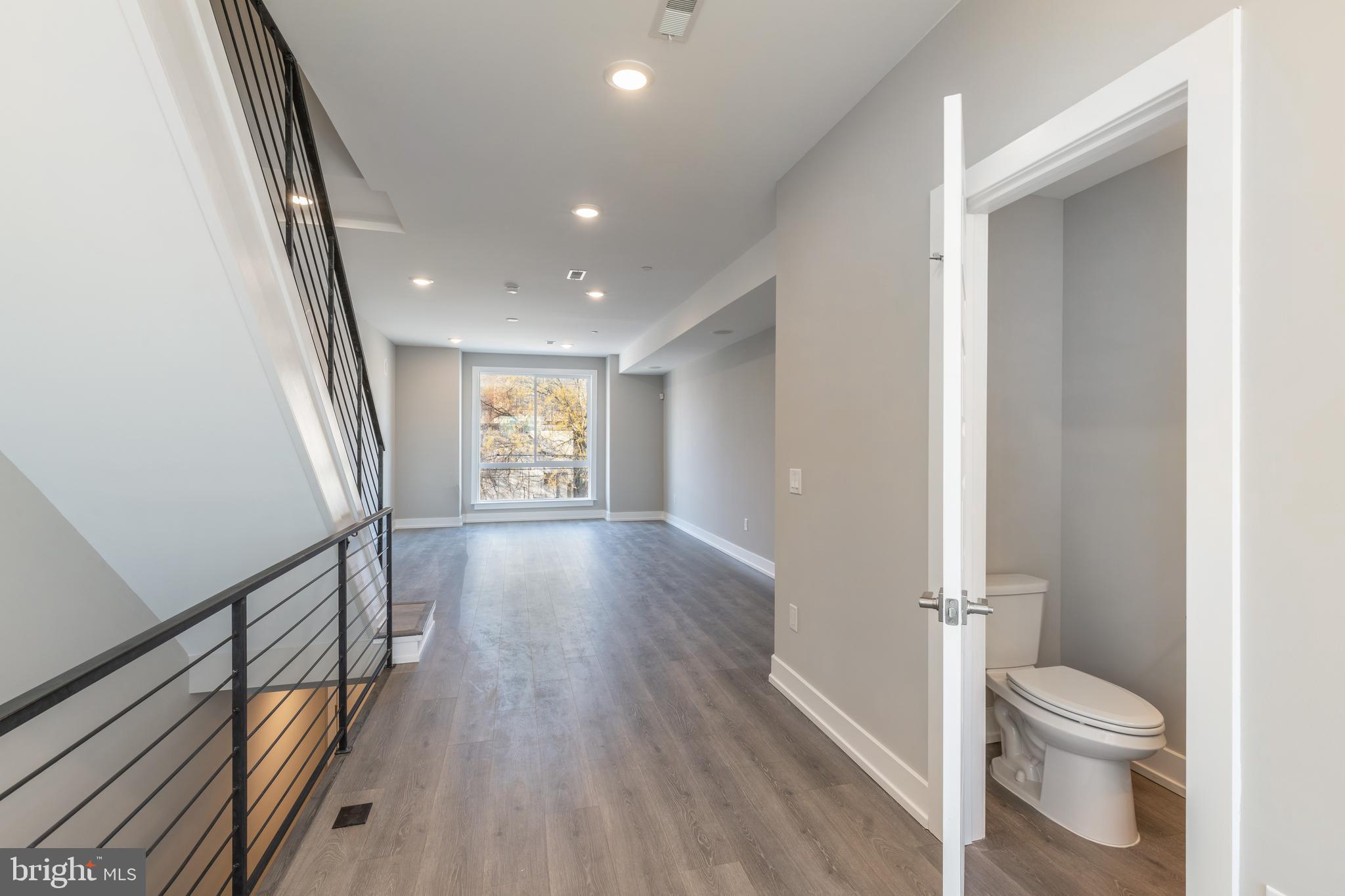 2327 North 3rd Street Philadelphia, PA 19133 - Photo 11 of 28 a bathroom with a toilet a sink and a mirror