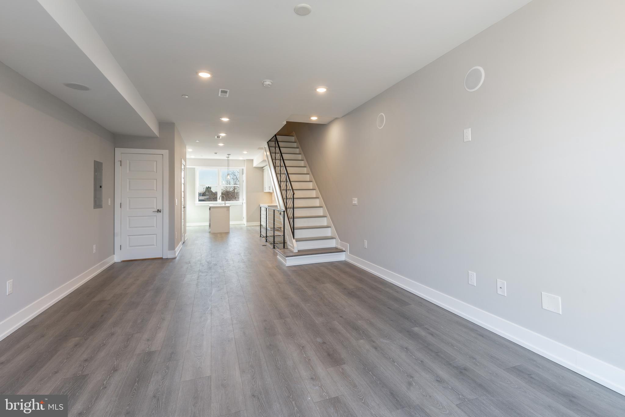 2327 North 3rd Street Philadelphia, PA 19133 - Photo 13 of 28 a view of an empty room with wooden floor and stairs