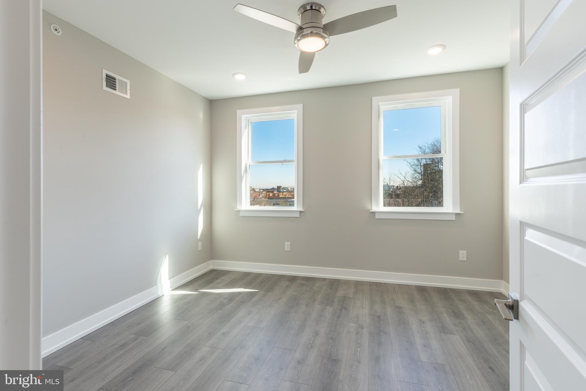 2327 North 3rd Street Philadelphia, PA 19133 - Photo 14 of 28 a view of room with window and hardwood floor
