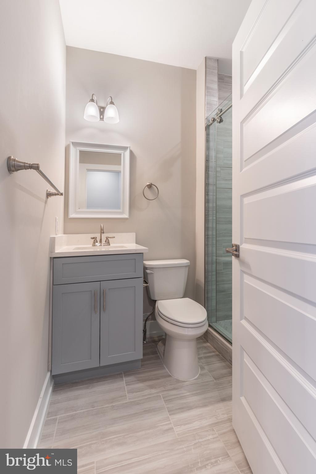 2327 North 3rd Street Philadelphia, PA 19133 - Photo 16 of 28 a bathroom with a toilet a sink and mirror