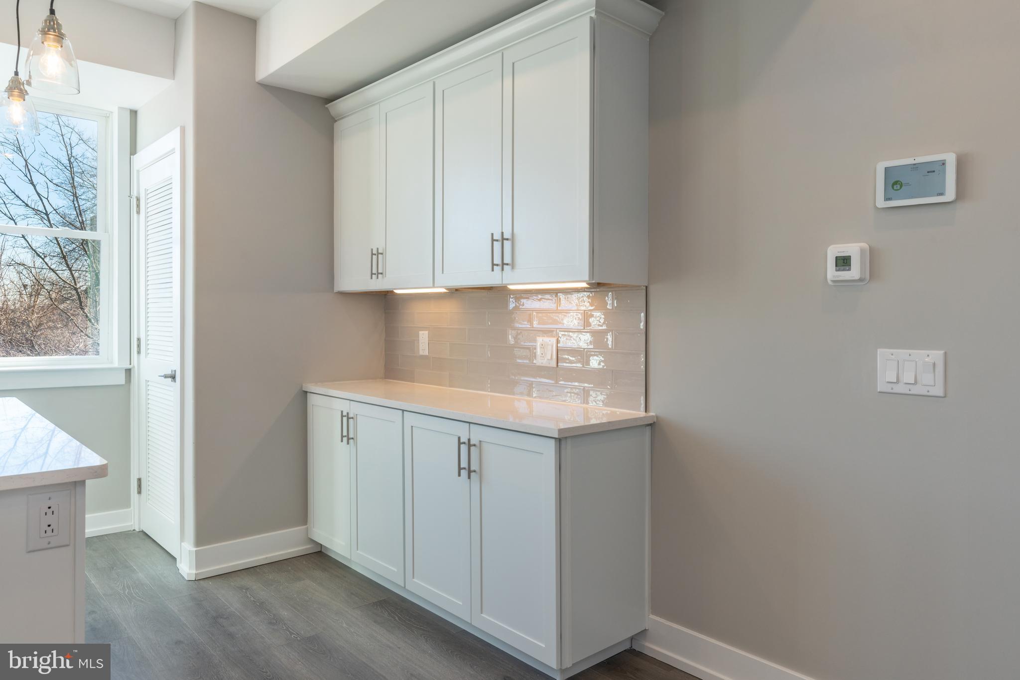 2327 North 3rd Street Philadelphia, PA 19133 - Photo 5 of 28 a view of cabinets and wooden floor