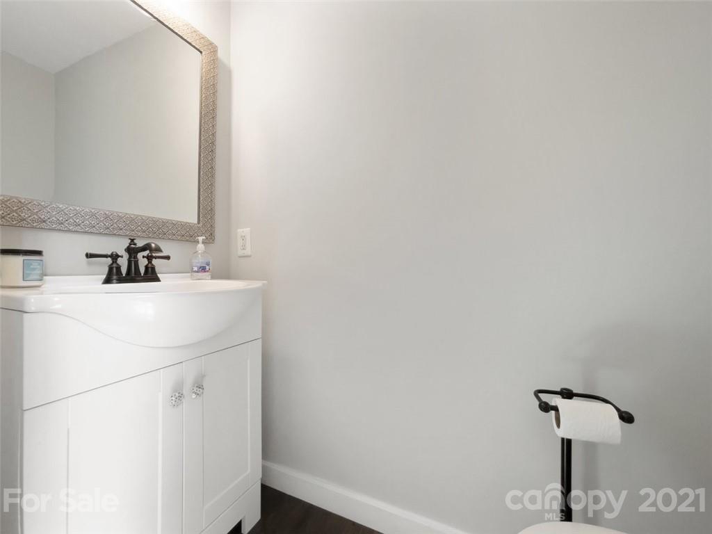 10017 Sardis Oaks Road Charlotte, NC 28270 - Photo 15 of 31 a bathroom with a sink and a mirror