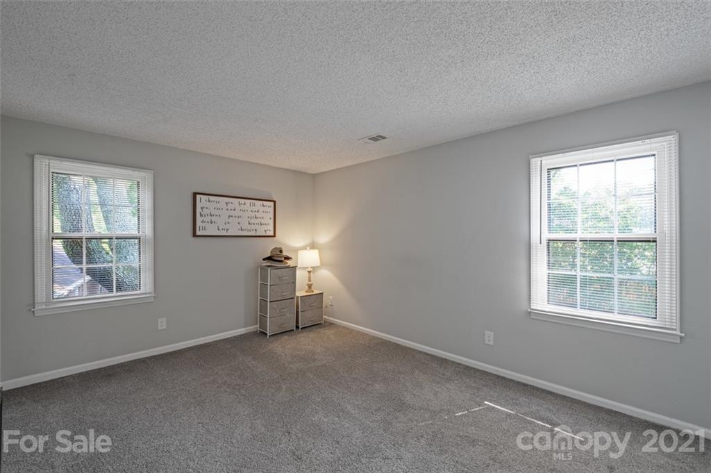 10017 Sardis Oaks Road Charlotte, NC 28270 - Photo 18 of 31 a view of empty room with windows