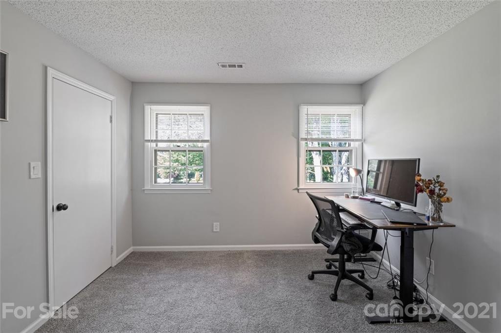 10017 Sardis Oaks Road Charlotte, NC 28270 - Photo 19 of 31 a view of a workspace with furniture and a window