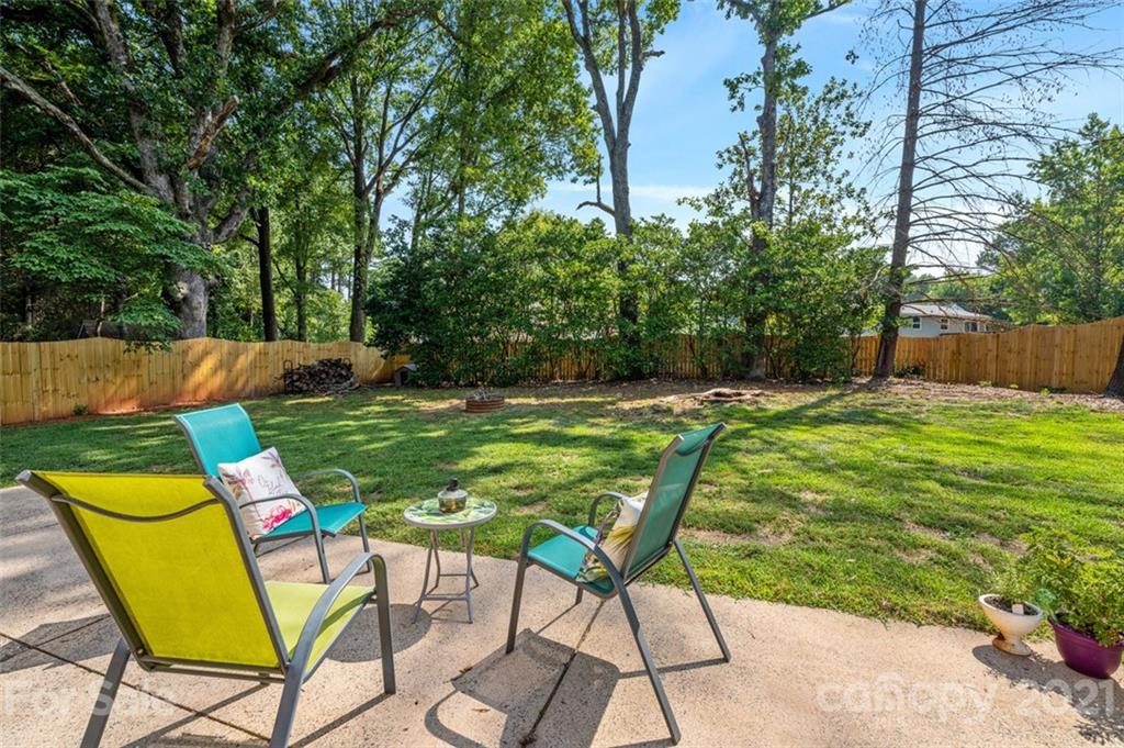 10017 Sardis Oaks Road Charlotte, NC 28270 - Photo 22 of 31 a view of an chairs and table in the garden