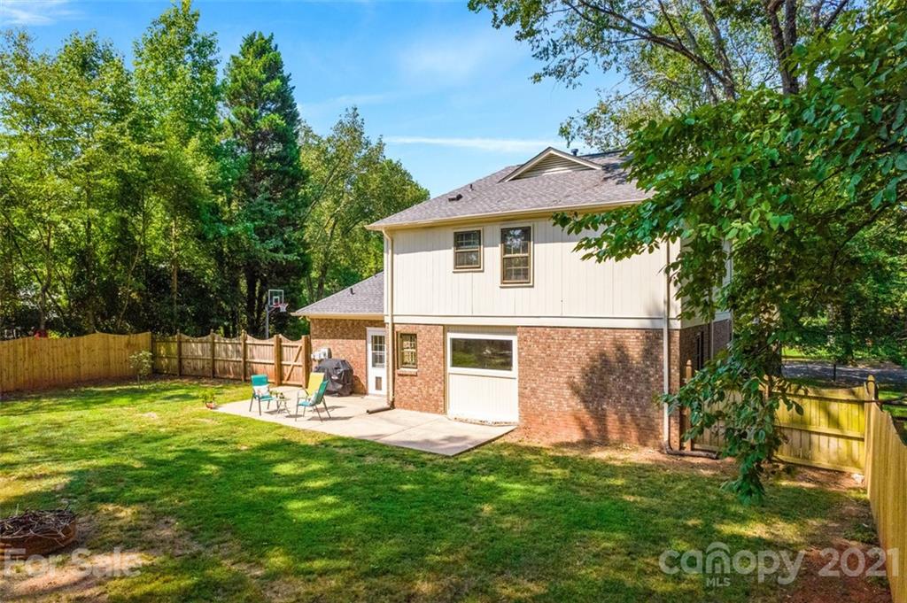 10017 Sardis Oaks Road Charlotte, NC 28270 - Photo 25 of 31 a view of a house with a yard porch and sitting area