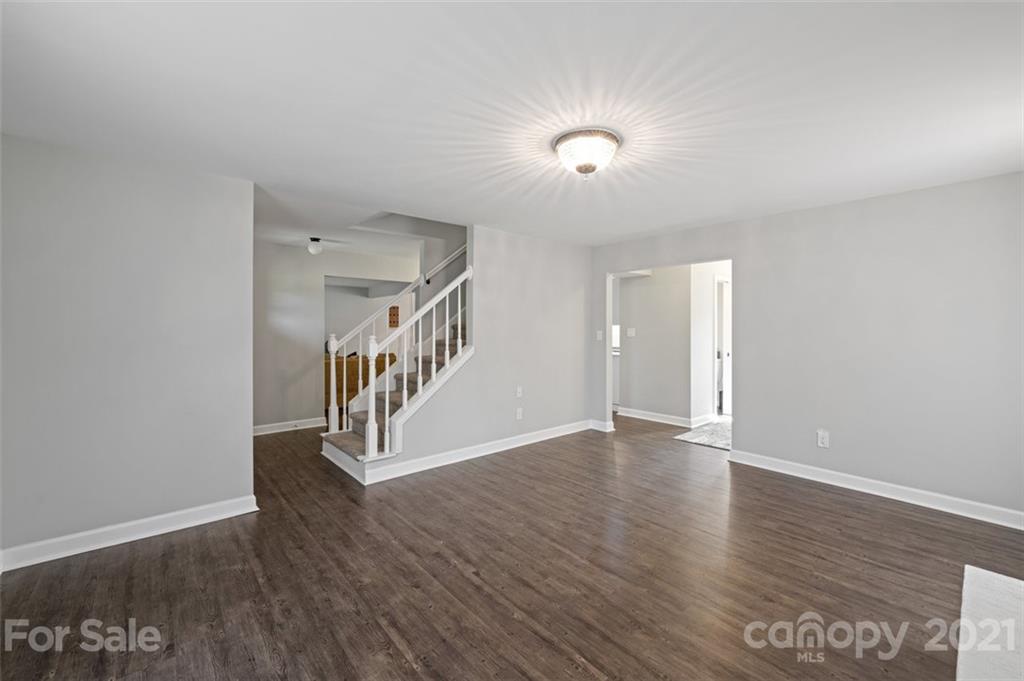 10017 Sardis Oaks Road Charlotte, NC 28270 - Photo 9 of 31 a view of an empty room with wooden floor
