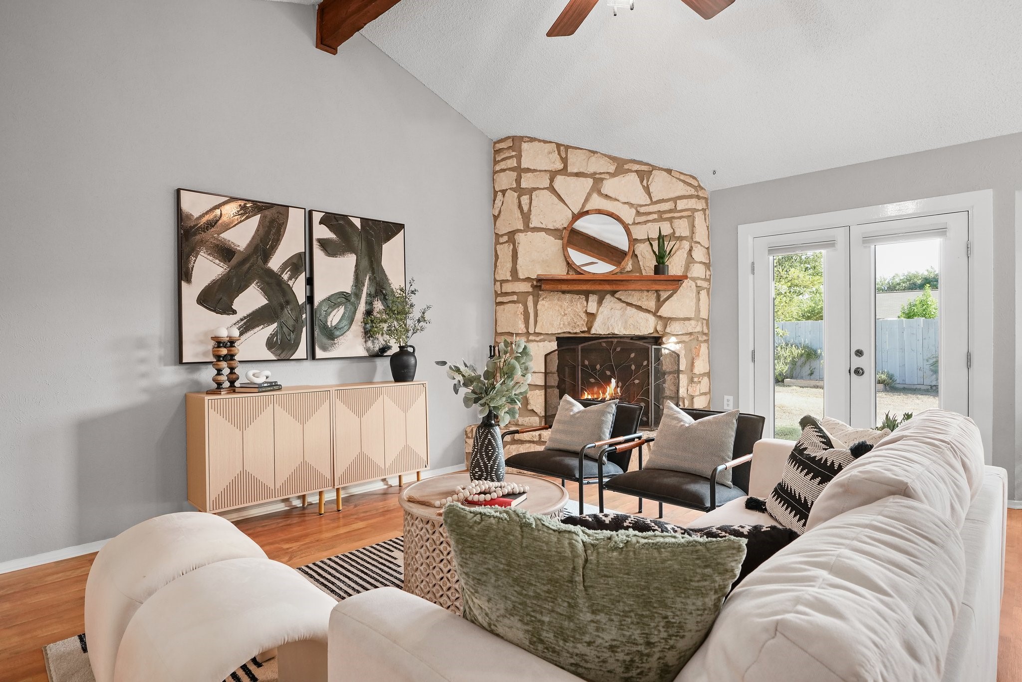 3805 Tamil Street Austin, TX 78749 - Photo 11 of 27 a living room with furniture a fireplace and a large window