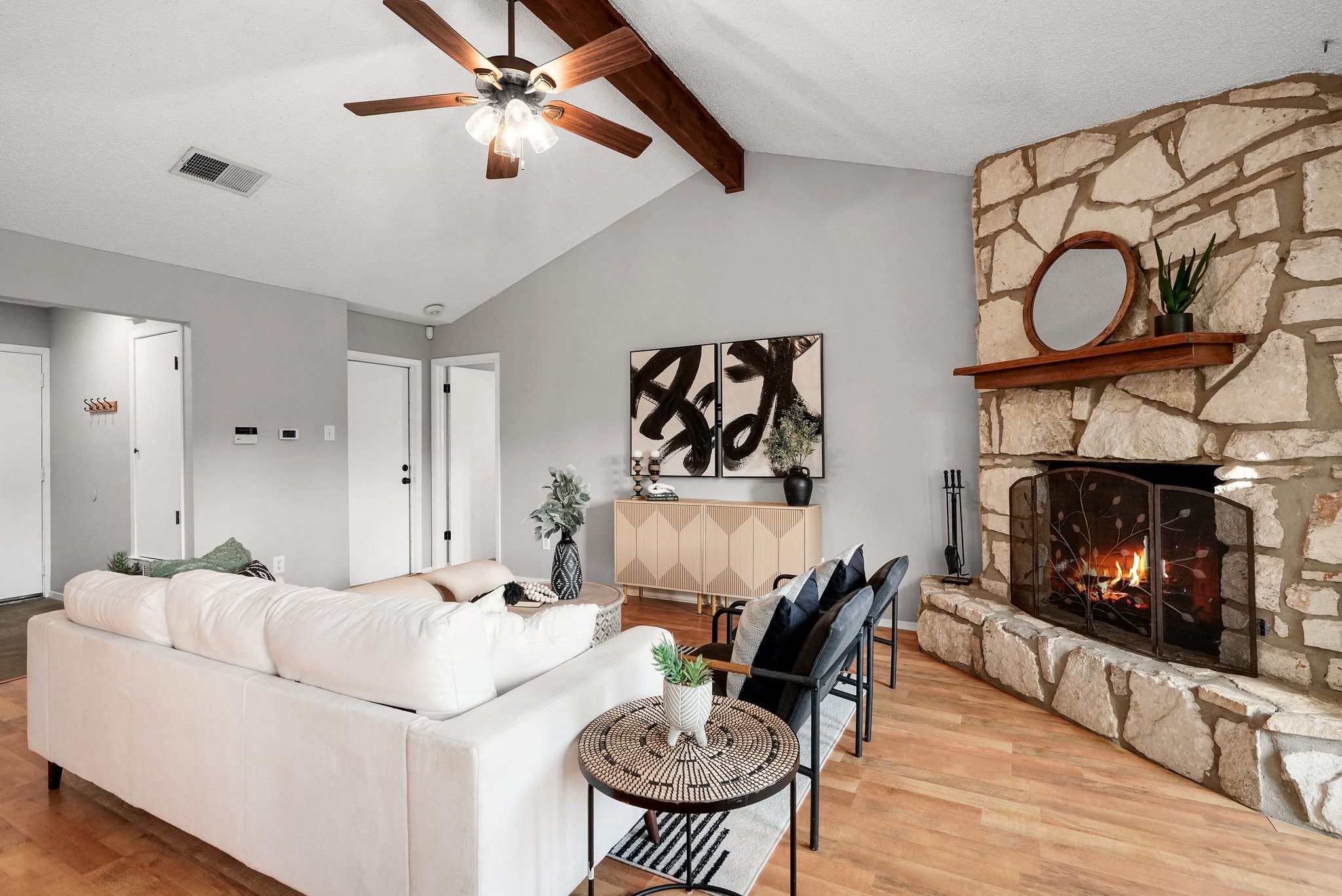 3805 Tamil Street Austin, TX 78749 - Photo 12 of 27 a living room with furniture a fireplace and kitchen view