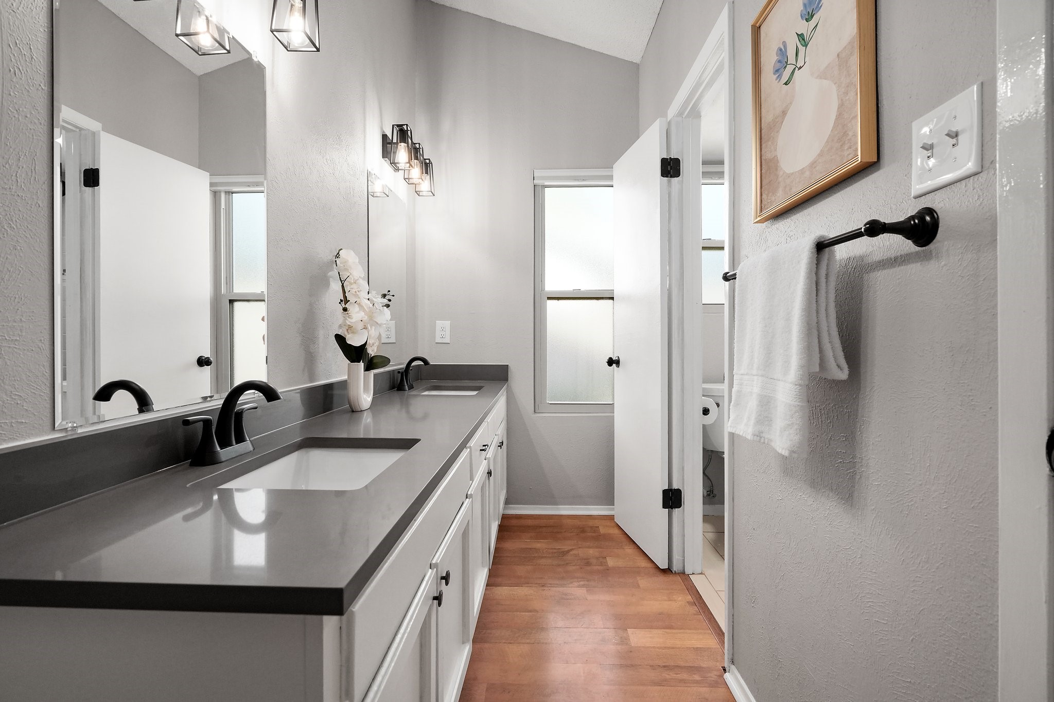 3805 Tamil Street Austin, TX 78749 - Photo 20 of 27 a bathroom with a double vanity sink a mirror a vanity and shower