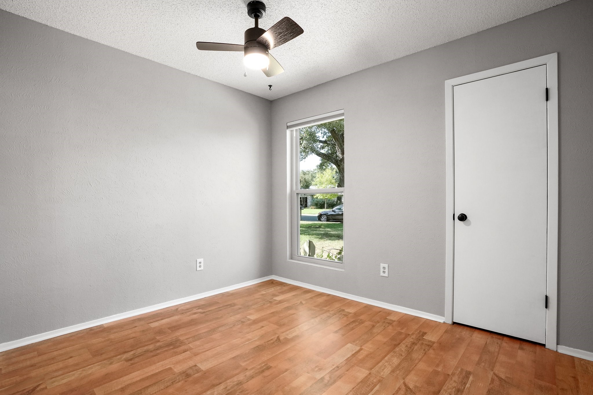 3805 Tamil Street Austin, TX 78749 - Photo 22 of 27 wooden floor in an empty room with a window