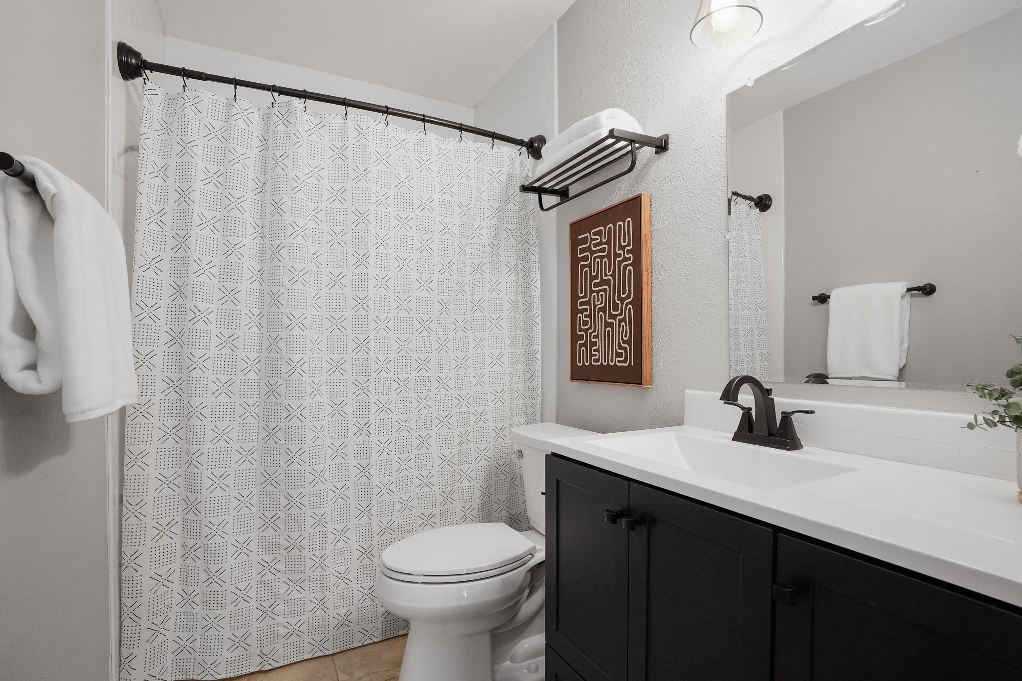 3805 Tamil Street Austin, TX 78749 - Photo 23 of 27 a bathroom with a sink and a mirror