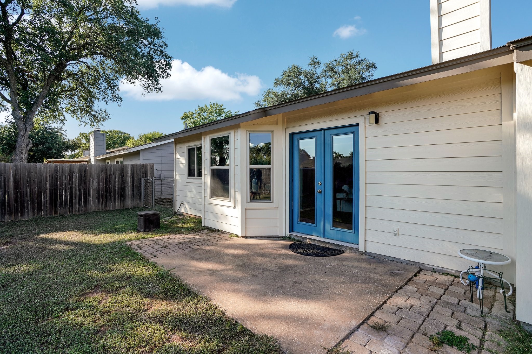 3805 Tamil Street Austin, TX 78749 - Photo 26 of 27 a backyard of a house with table and chairs