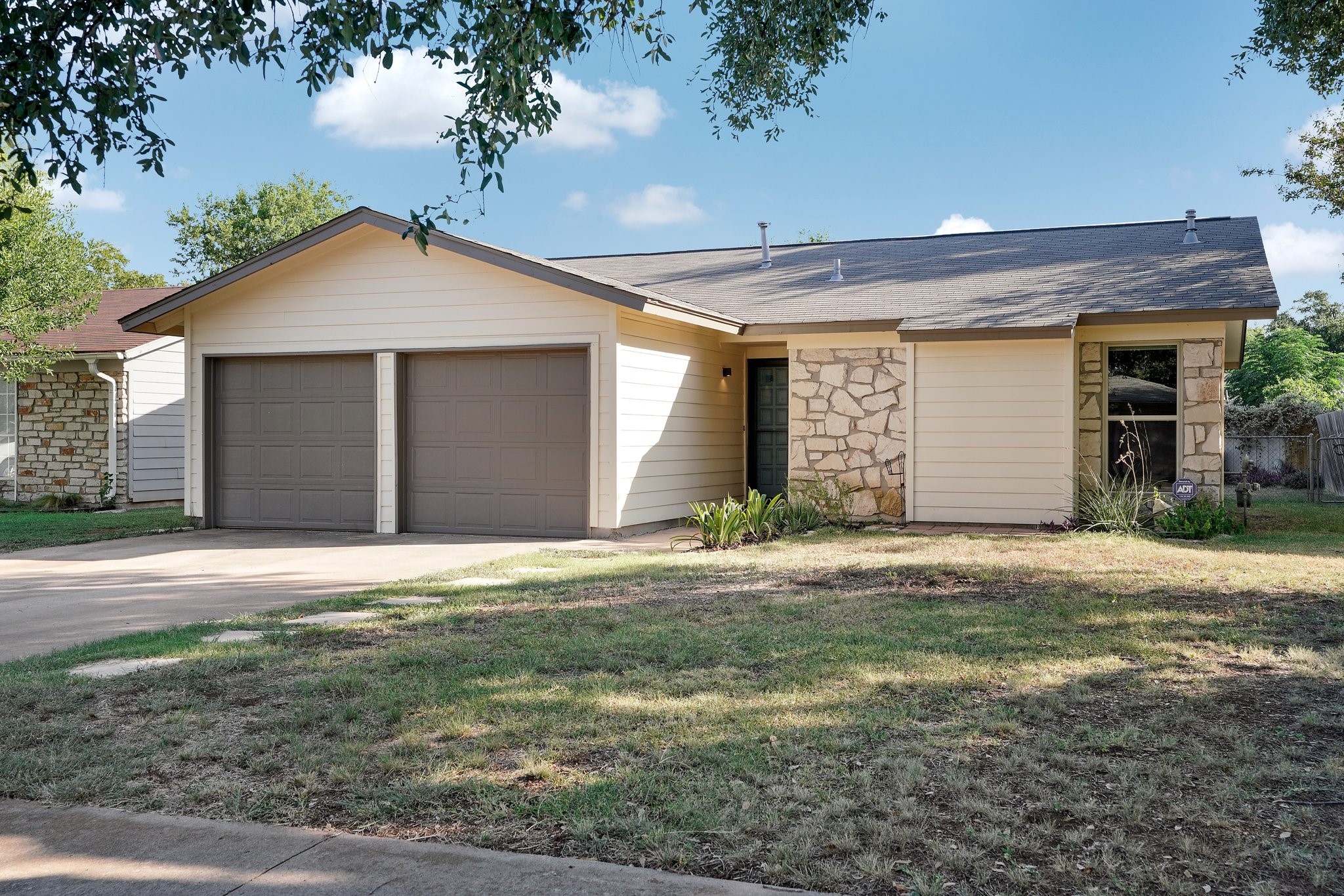 3805 Tamil Street Austin, TX 78749 - Photo 5 of 27 a front view of a house with a yard and garage