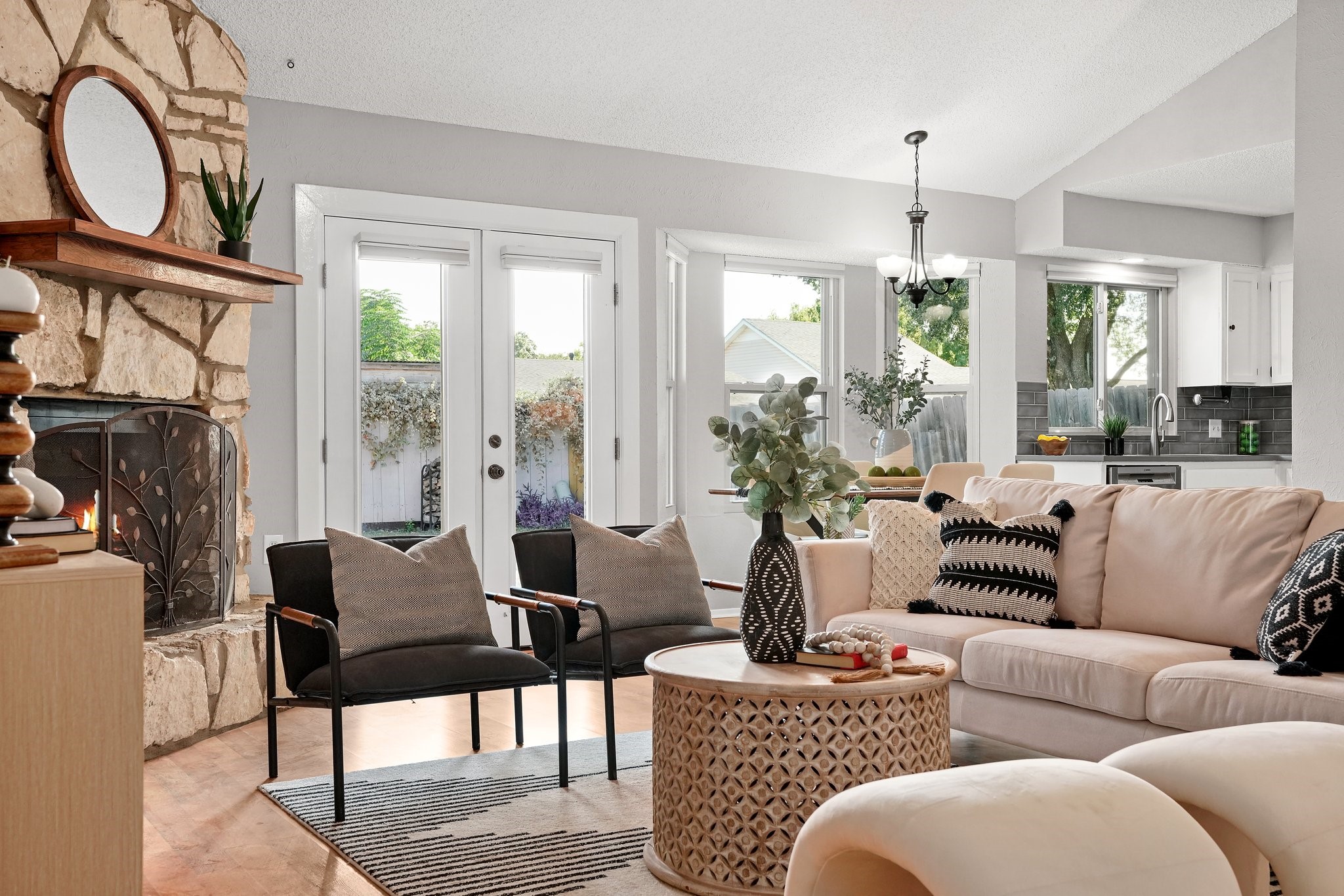 3805 Tamil Street Austin, TX 78749 - Photo 8 of 27 a living room with furniture a chandelier and a window
