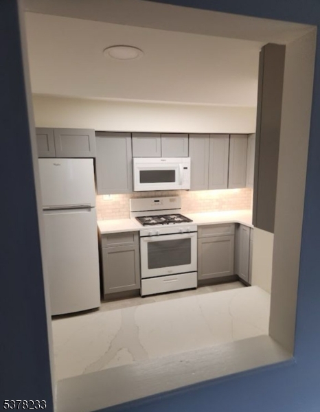 204 Bloomfield Avenue, Unit A Montclair, NJ 07042 - Photo 4 of 9 a kitchen with a stove and a refrigerator