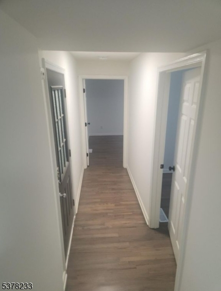 204 Bloomfield Avenue, Unit A Montclair, NJ 07042 - Photo 5 of 9 a view of a hallway with wooden floor and staircase