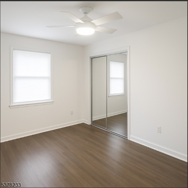 204 Bloomfield Avenue, Unit A Montclair, NJ 07042 - Photo 6 of 9 an empty room with wooden floor closet and windows