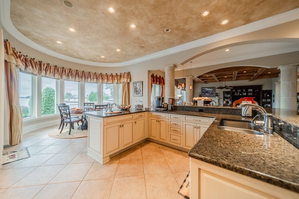 16339 Jetton Road Cornelius, NC 28031 - Photo 16 of 48 a kitchen with stainless steel appliances granite countertop a sink and white cabinets