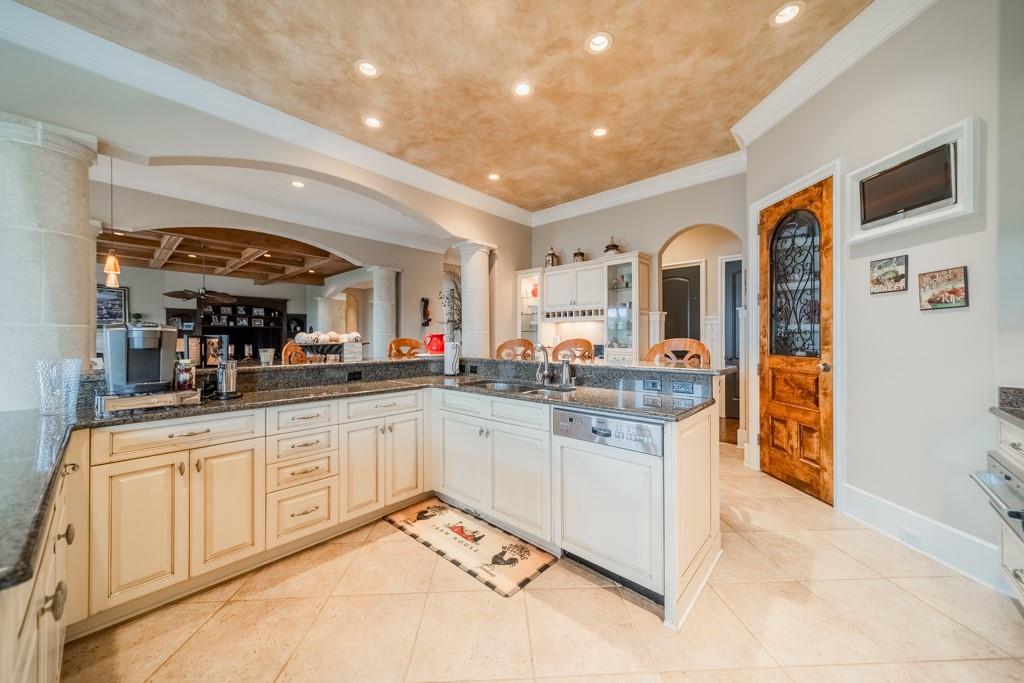 16339 Jetton Road Cornelius, NC 28031 - Photo 17 of 48 a large kitchen with stainless steel appliances granite countertop a large counter top and a stove