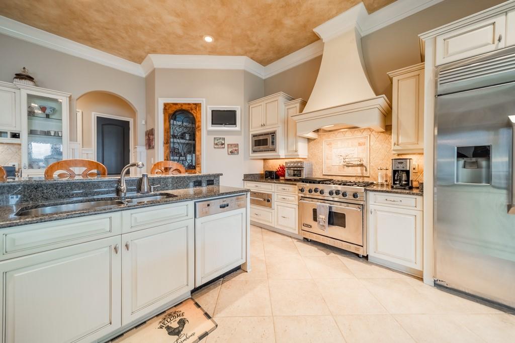 16339 Jetton Road Cornelius, NC 28031 - Photo 18 of 48 a kitchen with granite countertop white cabinets and white appliances