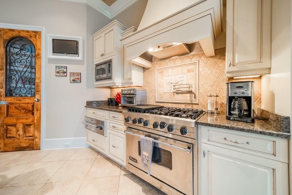 16339 Jetton Road Cornelius, NC 28031 - Photo 19 of 48 a kitchen with stainless steel appliances granite countertop a stove and a white cabinets