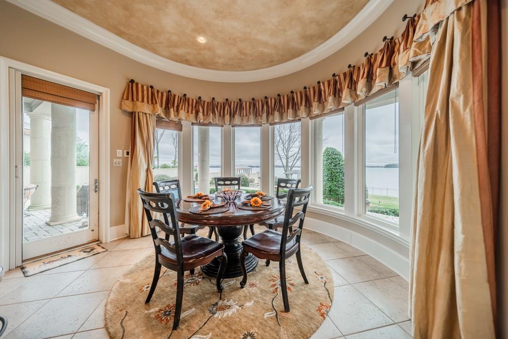 16339 Jetton Road Cornelius, NC 28031 - Photo 20 of 48 a view of a dining room with furniture window and wooden floor