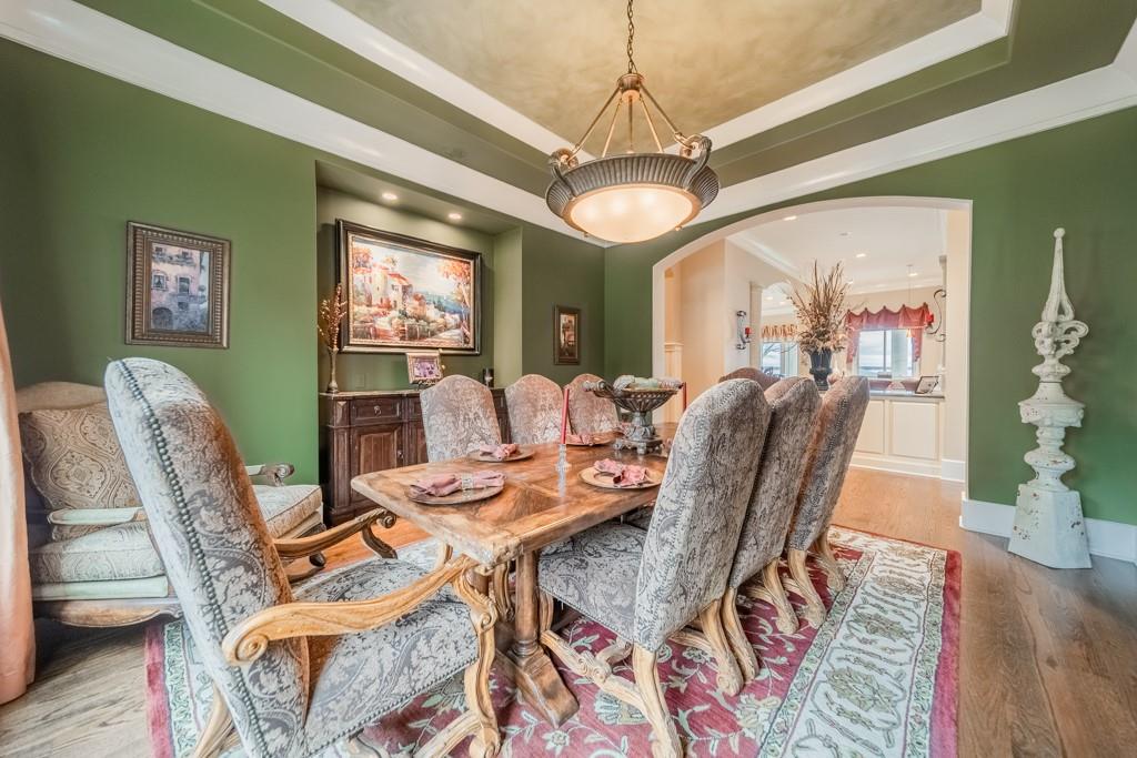 16339 Jetton Road Cornelius, NC 28031 - Photo 21 of 48 a view of a dining room with furniture window and wooden floor