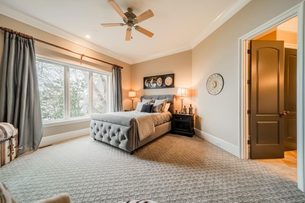 16339 Jetton Road Cornelius, NC 28031 - Photo 23 of 48 a spacious bedroom with a bed and a window