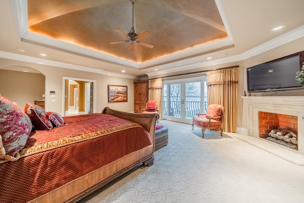 16339 Jetton Road Cornelius, NC 28031 - Photo 25 of 48 a bedroom with a bed and a flat screen tv