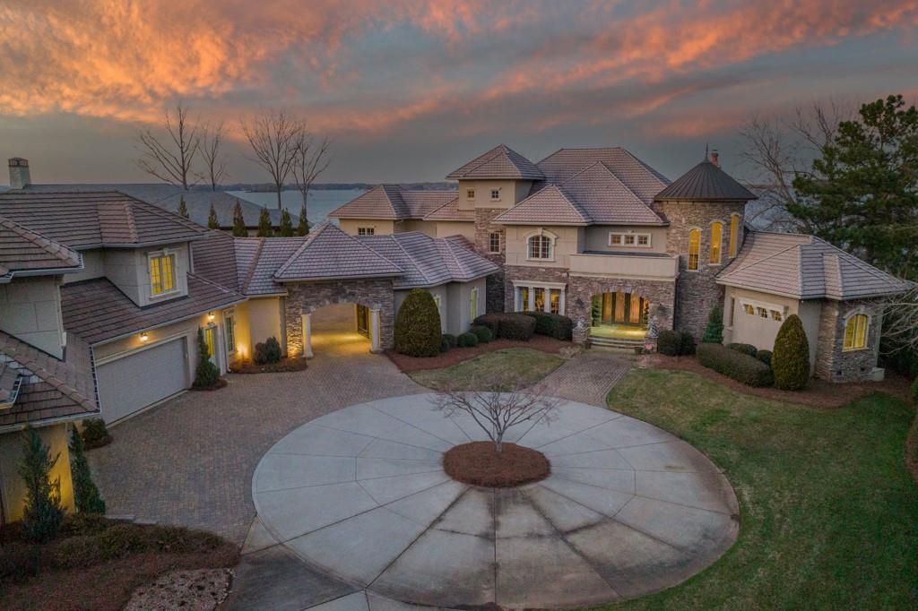 16339 Jetton Road Cornelius, NC 28031 - Photo 3 of 48 a view of a big house with a yard balcony