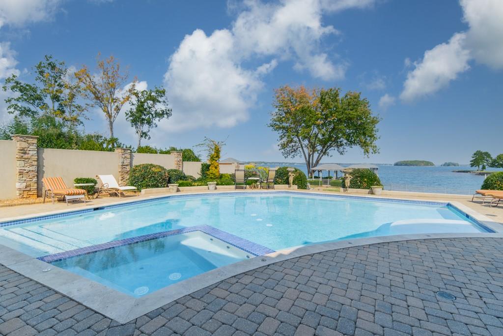 16339 Jetton Road Cornelius, NC 28031 - Photo 44 of 48 a view of a swimming pool with a yard
