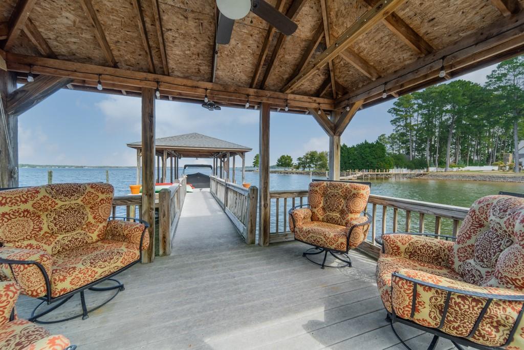 16339 Jetton Road Cornelius, NC 28031 - Photo 46 of 48 a balcony with furniture and an umbrella