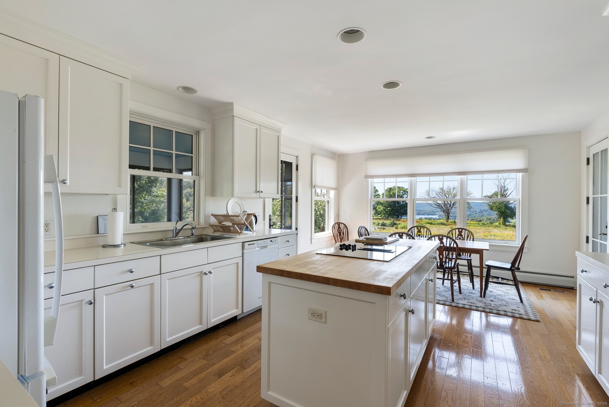 74 Tanner Hill Road Warren, CT 06777 - Photo 13 of 40 a view of a kitchen counter space and a wooden floor