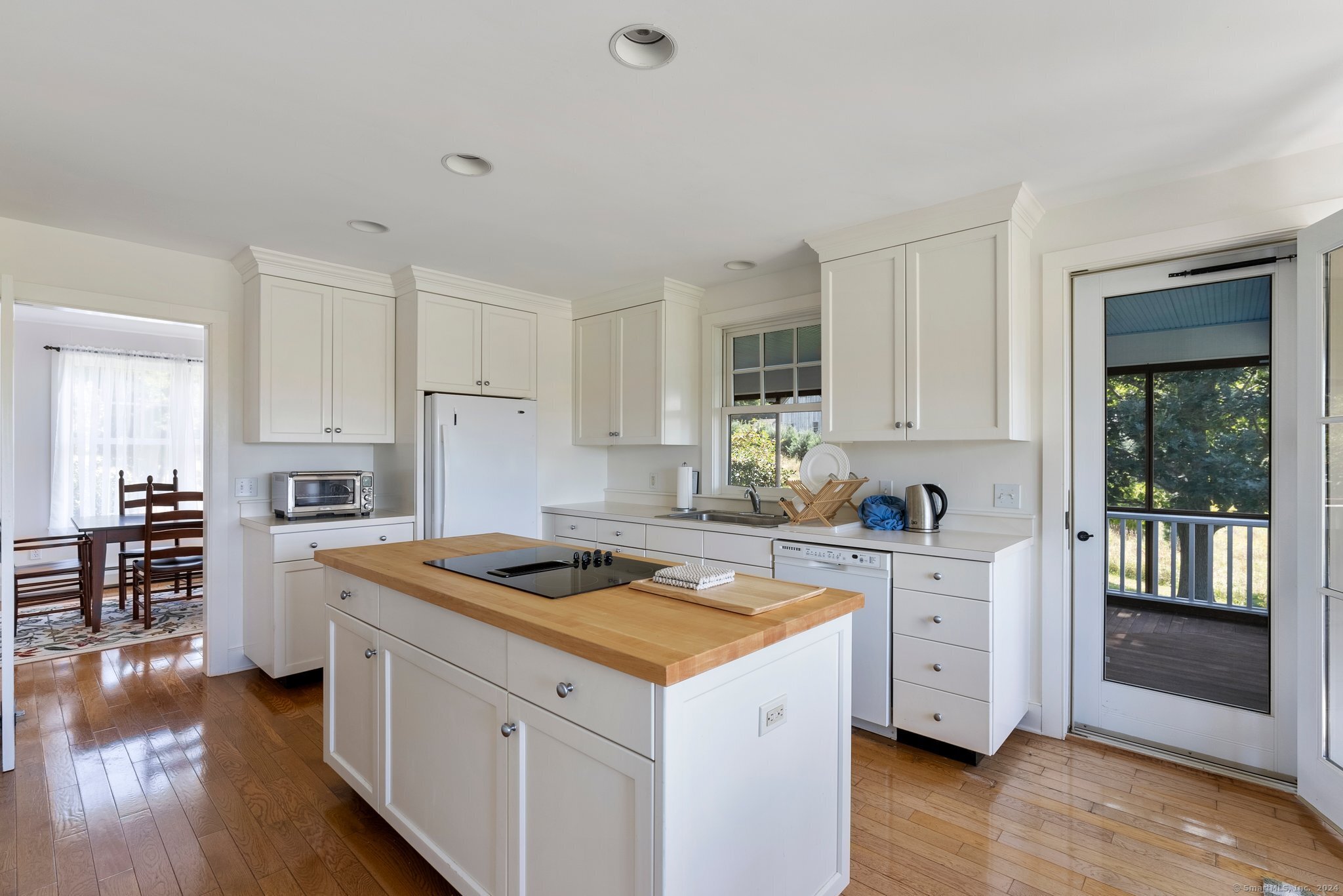 74 Tanner Hill Road Warren, CT 06777 - Photo 16 of 40 a kitchen with a stove a sink and a refrigerator
