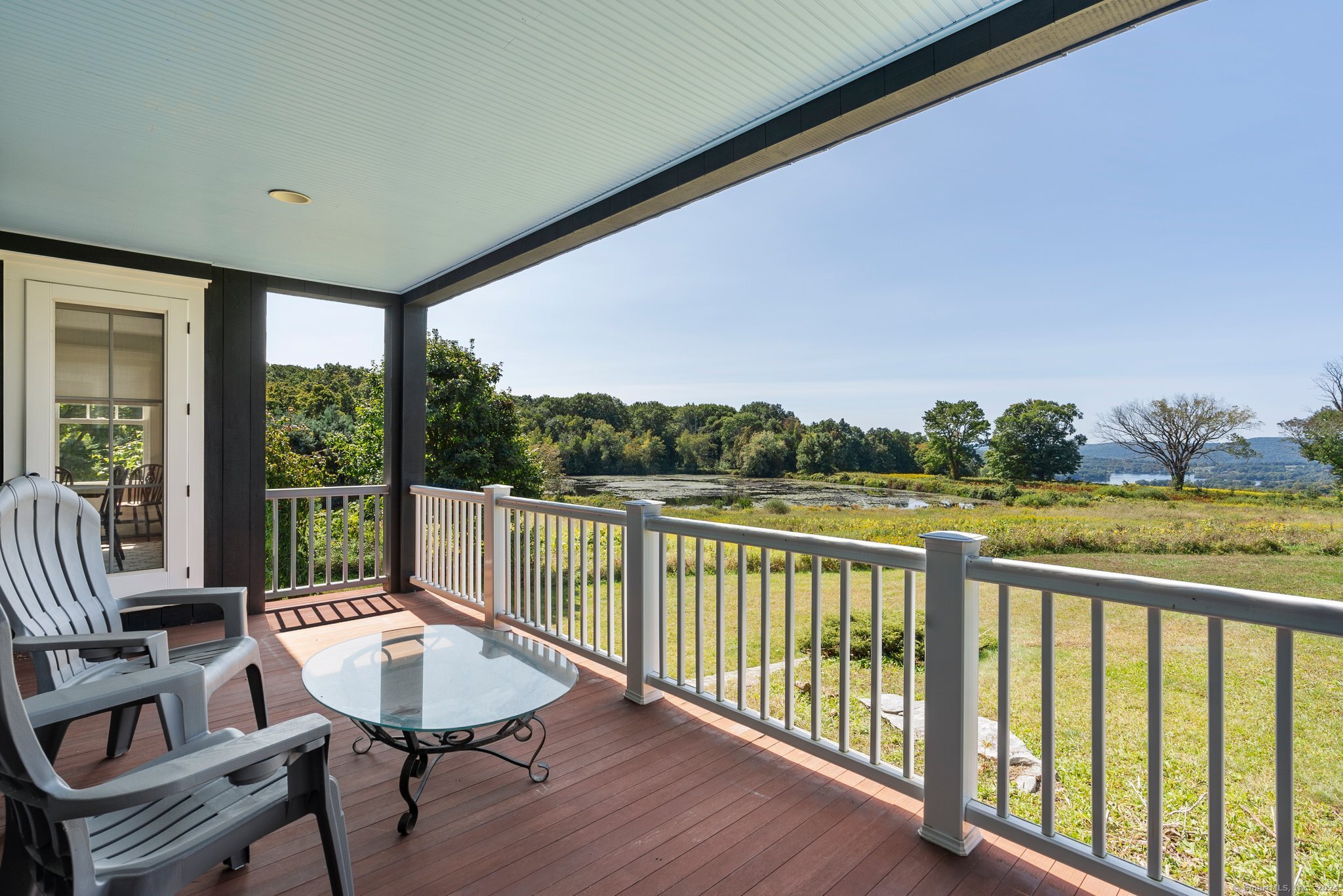74 Tanner Hill Road Warren, CT 06777 - Photo 22 of 40 a view of a balcony with furniture