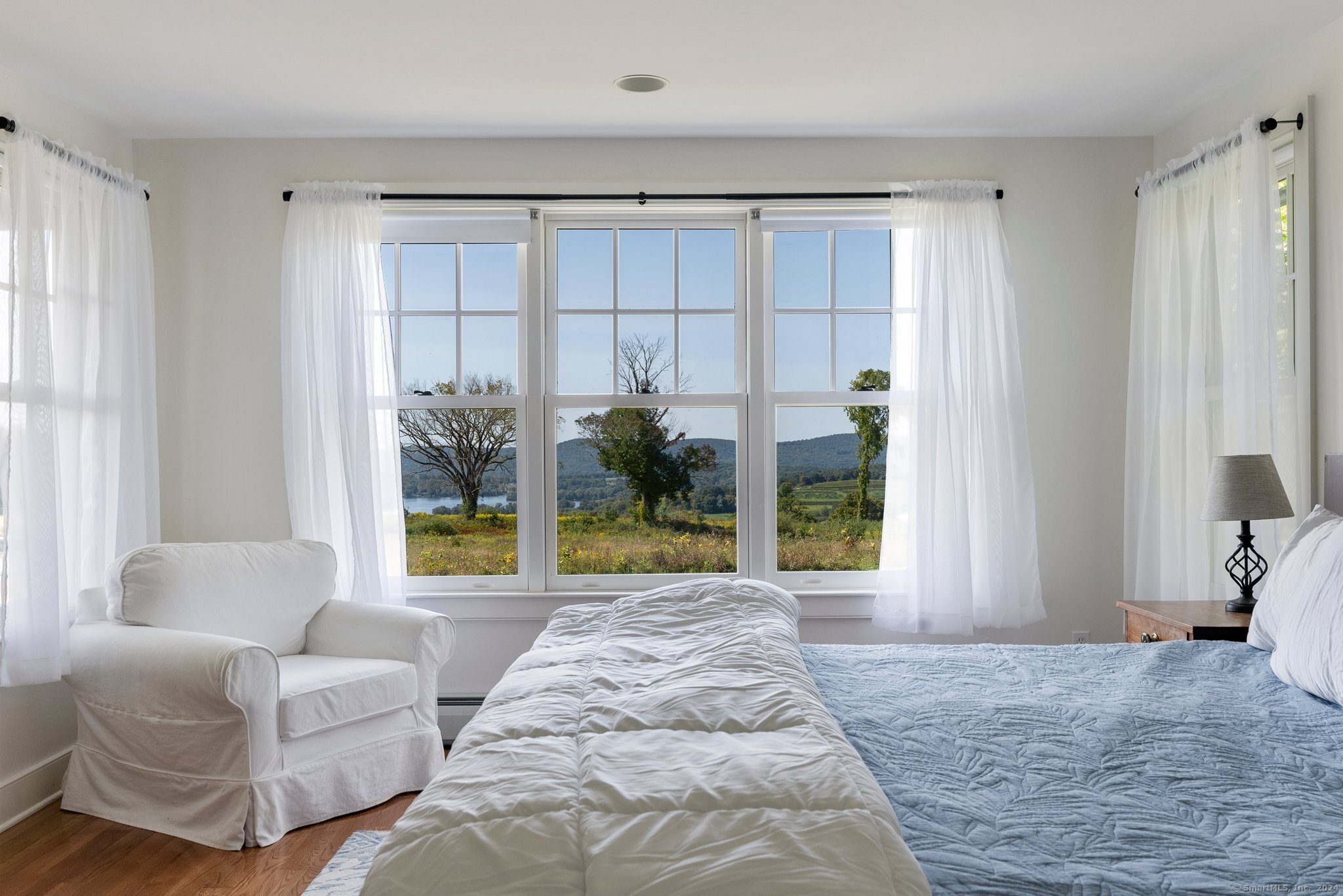 74 Tanner Hill Road Warren, CT 06777 - Photo 26 of 40 a bedroom with furniture and large windows