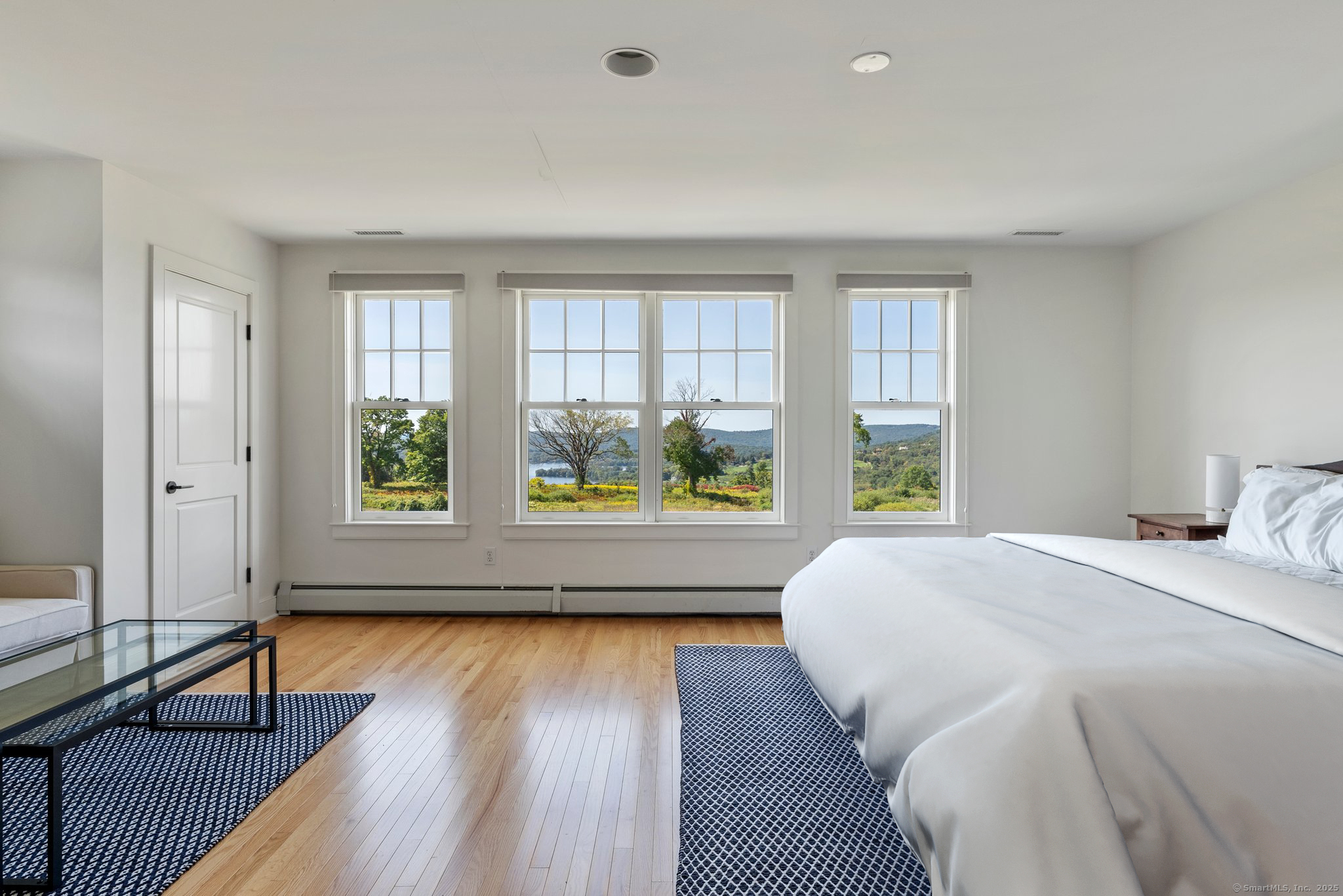 74 Tanner Hill Road Warren, CT 06777 - Photo 29 of 40 a bedroom with a bed and a large window