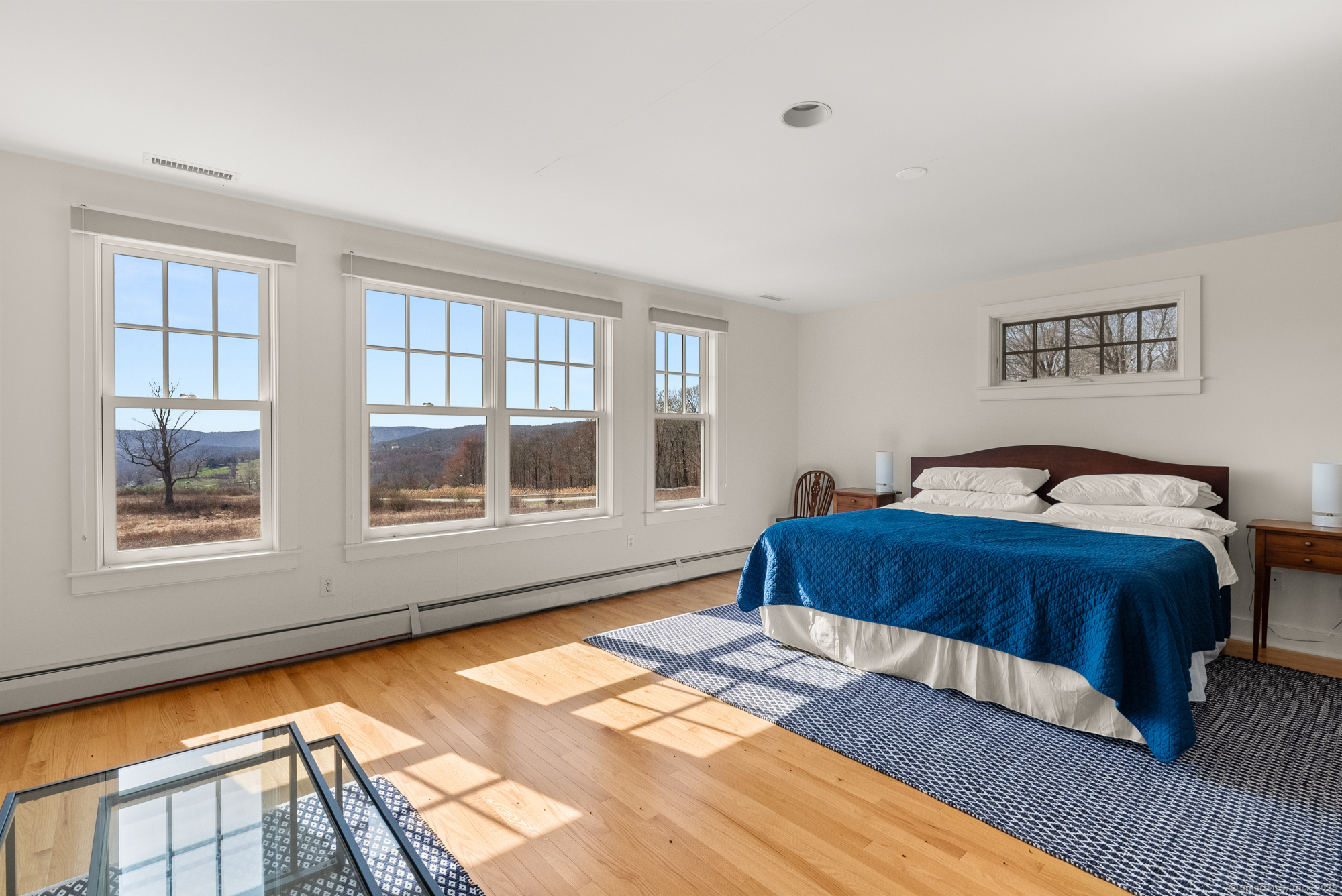 74 Tanner Hill Road Warren, CT 06777 - Photo 31 of 40 a bedroom with a bed and wooden floor