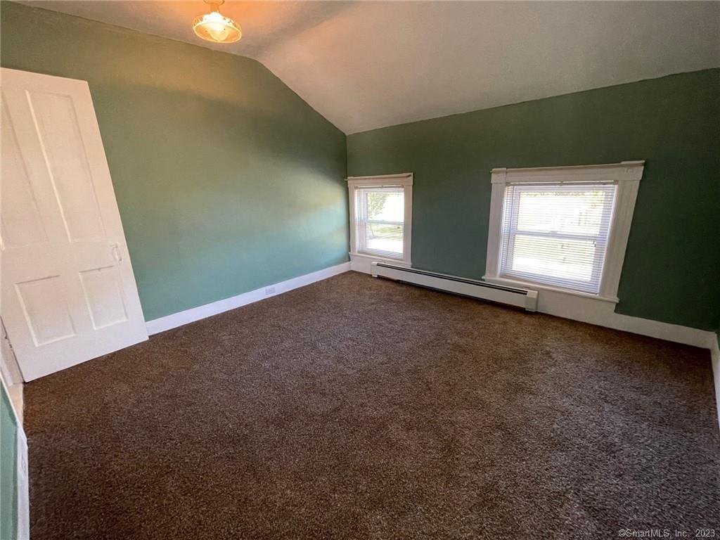 79 River Street, Unit 79 Sprague, CT 06330 - Photo 15 of 25 an empty room with windows