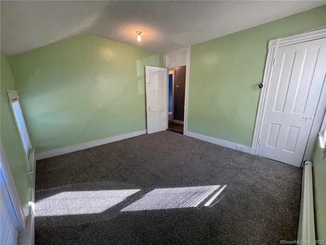 a view of an empty room with a window